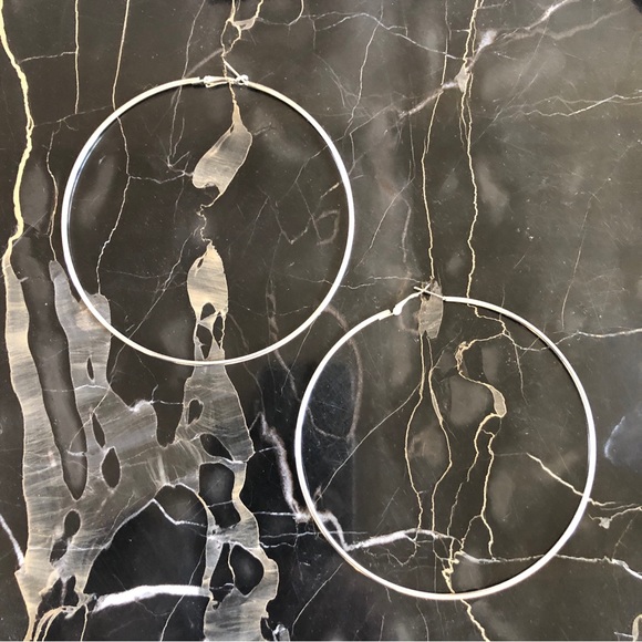 Jewelry - Real silver hoops. 4 1/4”. Smooth and shiny surface to reflect the light.